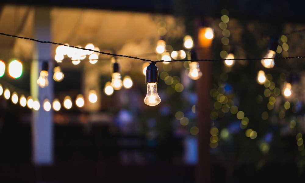 Outdoor bistro and café lighting, also known as bulb lights or café string lights, illuminating an outdoor space