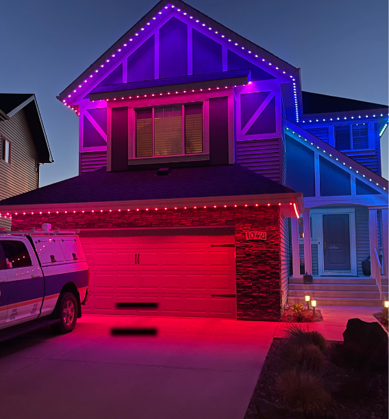house lit up in multiple colors with one lighting system