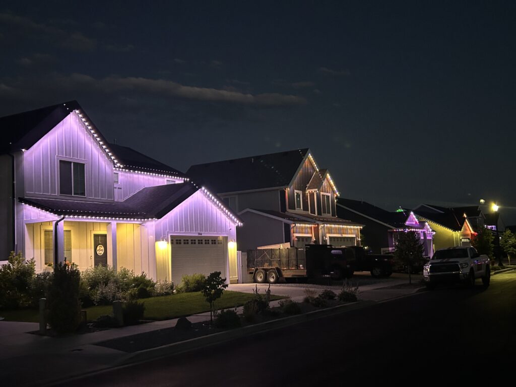 street with homes lit up