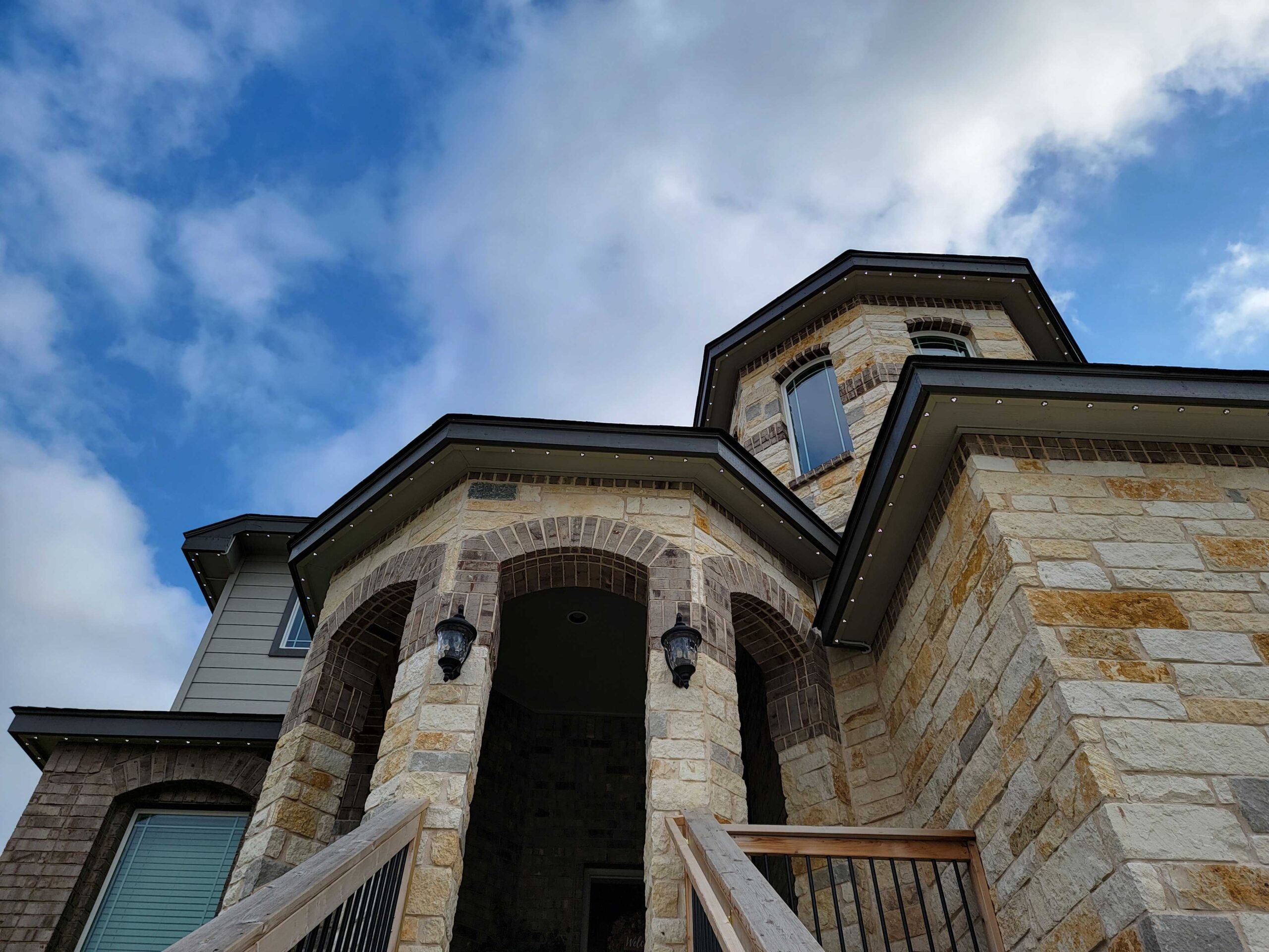 permanent holiday lighting track under roof