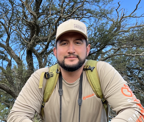 Professional headshot of the Austin, TX branch general manager at Astoria Lighting Co., photographed outdoors with a tree in the background.