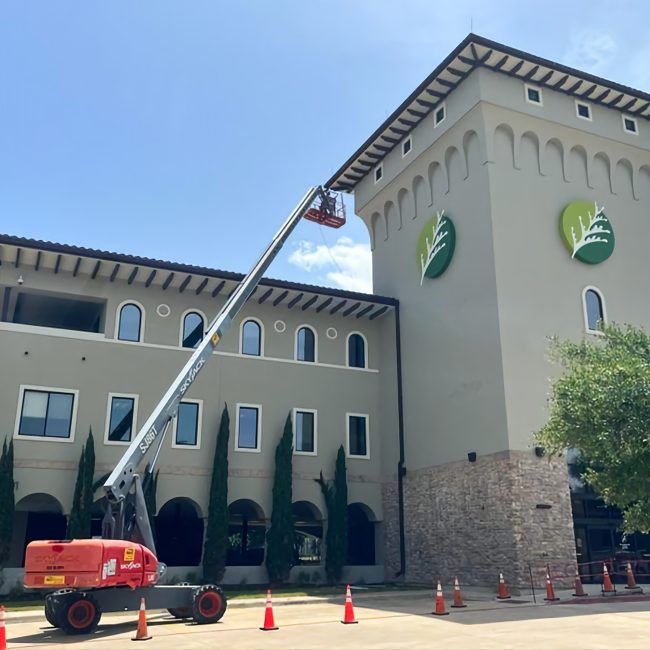 Astoria light installation on muti-story hotel soffit line.